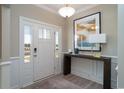 Bright foyer featuring a stylish console table, modern lighting, and elegant wainscoting at 4035 Bucolic Loop, Myrtle Beach, SC 29588