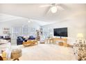 Spacious living room with vaulted ceilings, lots of natural light, and comfortable seating arrangements at 4283 Santolina Way # H, Murrells Inlet, SC 29576