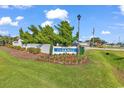 Well-maintained Parkway community sign featuring lush landscaping and vibrant greenery at 4291 Parkway Ln. # 4291, Little River, SC 29566