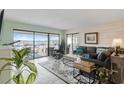 Inviting living room with sliding glass doors to a patio and views of the marina at 4440 Nassau Ct. # 502, Little River, SC 29566