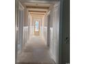 Bright hallway showcasing wood beam ceiling accents and wainscoting at 5023 Middleton View Dr., Myrtle Beach, SC 29579