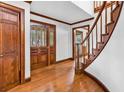 Foyer showcasing hardwood floors, trim and a decorative glass paneled front door at 5704 Woodside Ave., Myrtle Beach, SC 29577