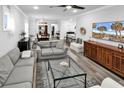 Spacious living room featuring wood floors, stylish furniture and plenty of natural light at 6013 Tramonto St., Myrtle Beach, SC 29577