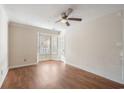 Bright bedroom with wood floors, a ceiling fan, and shuttered windows for natural light at 616 Mckinley Way, Conway, SC 29526