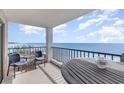 Spacious balcony showcasing breathtaking ocean views and comfortable seating with beach access at 6200 N Ocean Blvd. # 501, North Myrtle Beach, SC 29582
