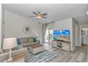 Bright living room with a comfortable sofa, stylish decor, and sliding glass doors at 1006 Charles St., North Myrtle Beach, SC 29582