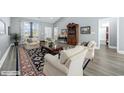 Comfortable living room features neutral paint, wood floors, and lots of natural light at 108 Silver Peak Dr., Conway, SC 29526