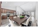 An open floorplan includes kitchen, living room, and dining area with neutral paint and wood floors at 108 Silver Peak Dr., Conway, SC 29526