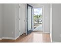 Bright foyer with hardwood floors, open doorway, and natural light streaming through the front door at 1097 Balmore Dr., Myrtle Beach, SC 29579
