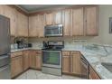 Well-equipped kitchen with granite countertops, stainless steel appliances, and ample cabinet space at 113B 13Th Ave. N, Surfside Beach, SC 29575