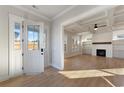 Bright and airy living room with hardwood floors and coffered ceiling at 115 S Middleton Dr. Nw, Calabash, NC 28467