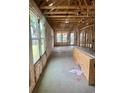 Unfinished home interior with exposed beams and framed windows ready for customization at 1241 Lady Bird Way, North Myrtle Beach, SC 29582