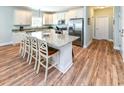 Modern kitchen features a center island with counter seating and stainless steel appliances at 1614-B S Ocean Blvd., Surfside Beach, SC 29575