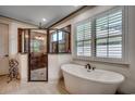 Stylish bathroom with a freestanding tub and walk-in shower with glass enclosure, complemented by natural light at 2131 Timmerman Rd., Myrtle Beach, SC 29588