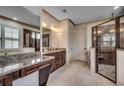 Elegant bathroom featuring dual vanities, granite countertops, and a glass-enclosed shower with tile surround at 2131 Timmerman Rd., Myrtle Beach, SC 29588