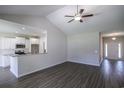 Bright and open living space with wood floors flowing to the kitchen area and front entrance at 275 Stillbrook Dr., Longs, SC 29568