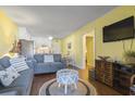 Comfortable living room featuring a gray sofa, decorative pillows, and stylish decor at 401 Hillside Dr. N # 2F, North Myrtle Beach, SC 29582