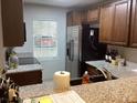 Kitchen featuring granite countertops, stainless steel appliances, and wood cabinetry at 501 44Th Ave. N # A-11, Myrtle Beach, SC 29577