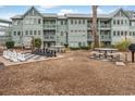 Exterior view showcasing a community area with a giant chessboard and picnic tables, perfect for outdoor gatherings at 5905 South Kings Hwy. # 4219-D, Myrtle Beach, SC 29575