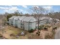 Aerial view of a well-maintained building, displaying multiple balconies and a charming playground at 5905 South Kings Hwy. # 4107-D, Myrtle Beach, SC 29575