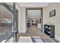 Bright foyer with tile flooring, shoe storage and clear view to an open concept kitchen, dining, and living area at 823 Waterton Ave., Myrtle Beach, SC 29579