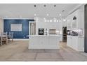 Bright kitchen boasts stainless appliances, center island, and sleek, modern cabinetry with open floor plan at 823 Waterton Ave., Myrtle Beach, SC 29579