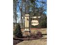Elegant community entrance sign with the 'Northbrook' name, set amidst manicured landscaping and tall trees at 85 Northbrook Dr, Murrells Inlet, SC 29576