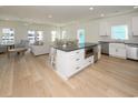 Open-concept kitchen with a large island, stainless steel appliances, and modern finishes at 1211-B N Waccamaw Dr., Garden City Beach, SC 29576