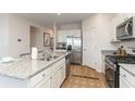Modern kitchen with stainless steel appliances, granite countertops, and an island with barstool seating at 1450 Nokota Dr., Conway, SC 29526