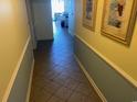 Hallway with tiled flooring leading into the home at 1625 S Ocean Blvd. # 802, North Myrtle Beach, SC 29582
