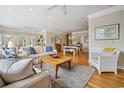 Spacious living room with hardwood floors, neutral decor, and lots of natural light at 165 Marsh Lake Dr. # 27, Georgetown, SC 29440