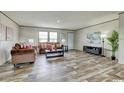 Spacious living room featuring wood floors, neutral paint, comfortable sofas, and natural light at 2016 Misty Morning Dr., Conway, SC 29527