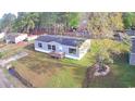 Aerial view of a single-story home with a well-manicured lawn and a wooden porch at 2016 Misty Morning Dr., Conway, SC 29527