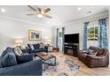 Cozy living room with a ceiling fan, modern decor, and a comfortable seating arrangement at 308 Golan Circle # A, Myrtle Beach, SC 29579
