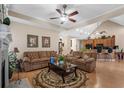 The living room features hardwood floors, neutral colors, two sofas, and a ceiling fan for added comfort at 387 Foxtail Dr., Longs, SC 29568