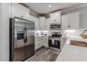 Beautiful kitchen with stainless steel appliances, white cabinets, and a spacious layout at 395 S Crow Creek Dr. # 1710, Calabash, NC 28467