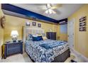 Cozy bedroom with blue and yellow beach-themed decor and a queen-sized bed with decorative pillows at 4103 N Ocean Blvd. # 304, North Myrtle Beach, SC 29582