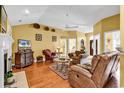 Comfortable living area featuring a fireplace, hardwood floors, and ample seating at 540 Alderly Ct., Little River, SC 29566