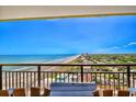 Enjoy spectacular, unobstructed ocean views from this lovely balcony with stylish outdoor seating and a table at 6804 N Ocean Blvd. # 1639, Myrtle Beach, SC 29572