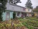 Exterior view showing multiple units with cozy front yards and colorful facades at 7 Century St. # 7, Myrtle Beach, SC 29577