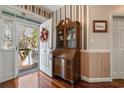 Elegant foyer featuring a wooden secretary desk and a view of the front porch at 728 Elizabeth Dr., Murrells Inlet, SC 29576