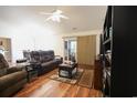 Inviting living room boasts hardwood floors, a fireplace, and plenty of room for entertaining at 793 Drawbridge Dr., Conway, SC 29526
