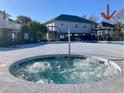 Close-up view of community hot tub with seating, located next to the community swimming pool at 820 9Th Ave. S, North Myrtle Beach, SC 29582