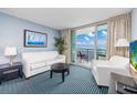 Bright living room with ocean view balcony, comfortable seating, and tasteful decor, perfect for relaxing at 107 S Ocean Blvd. # 1706, Myrtle Beach, SC 29577