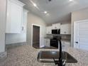 Modern kitchen with granite countertops, stainless steel appliances, and ample cabinet space at 126 Palm Dr., Loris, SC 29569