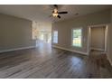 Spacious living room featuring modern flooring, neutral paint, and bright natural light at 126 Palm Dr., Loris, SC 29569