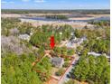 Expansive aerial view of property featuring lush greenery and water views, outlined in red at 1539 Old Town Ave., Georgetown, SC 29440