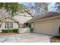 Charming home with lush landscaping, a two-car garage, and a lovely courtyard at 1827 Spinnaker Dr., North Myrtle Beach, SC 29582