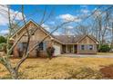 Beautiful brick home featuring a spacious driveway, two car garage and blue shutters at 20 Brassie Dr., Carolina Shores, NC 28467