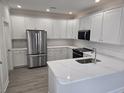 Modern kitchen featuring stainless steel appliances, white cabinets, and beautiful countertops at 326 46Th Ave. N, North Myrtle Beach, SC 29582